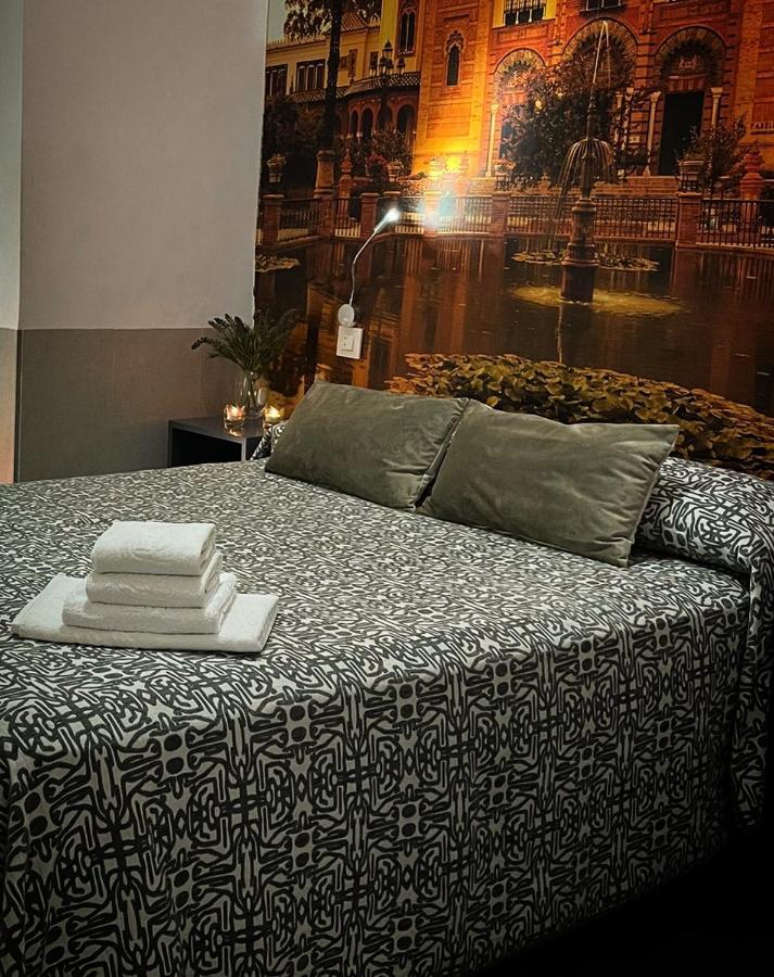 塞维利亚 帕科斯旅馆酒店 外观 照片 A bed with a duvet